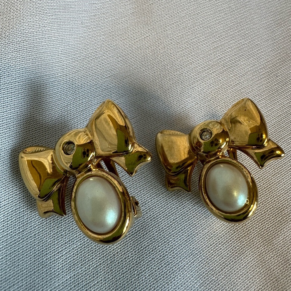 A set of vintage gold-plated Nina Ricci clip-on earrings